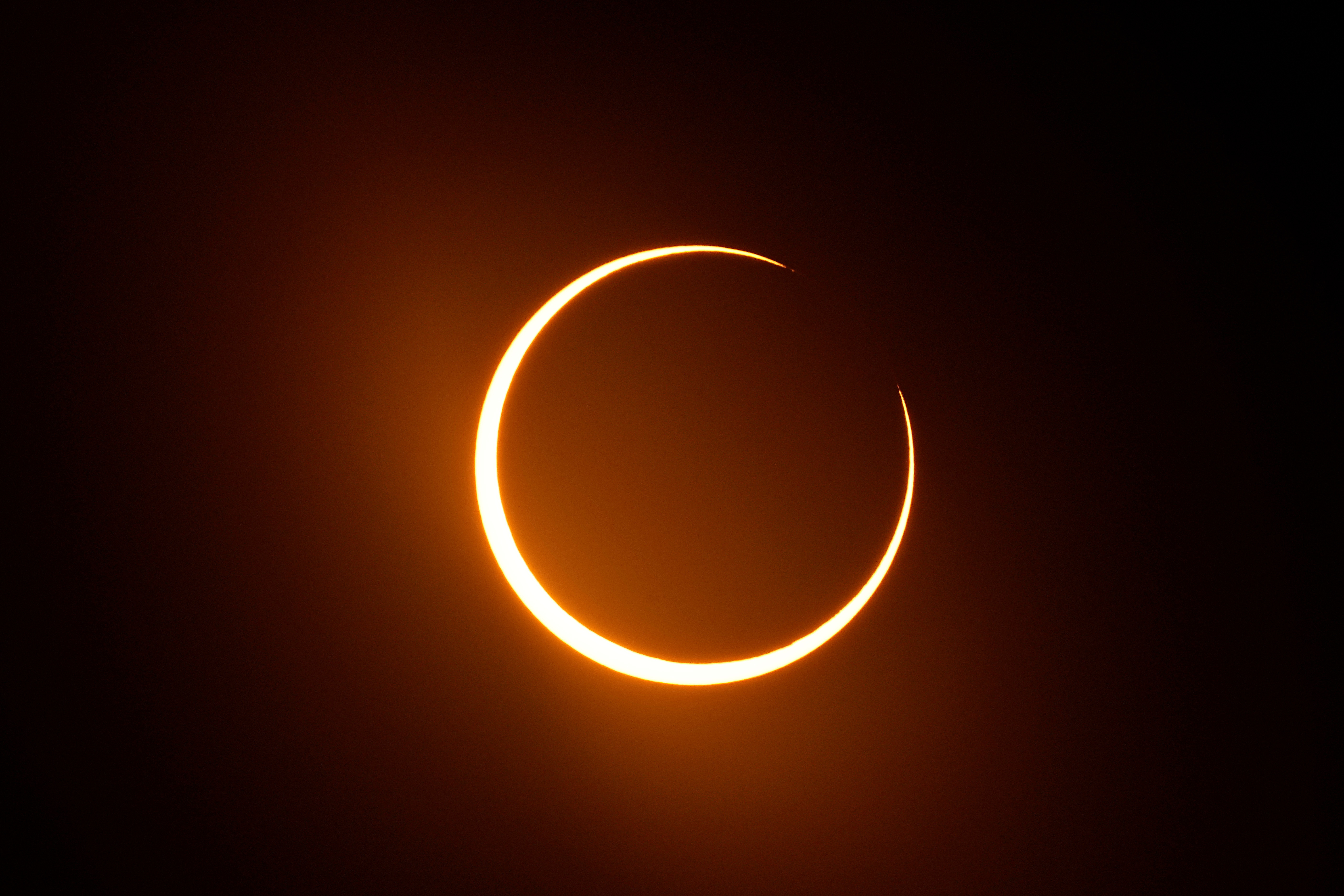 FILE - The moon moves in front of the sun during an annular solar eclipse, or ring of fire, seen from San Antonio, on Saturday, Oct. 14, 2023. 