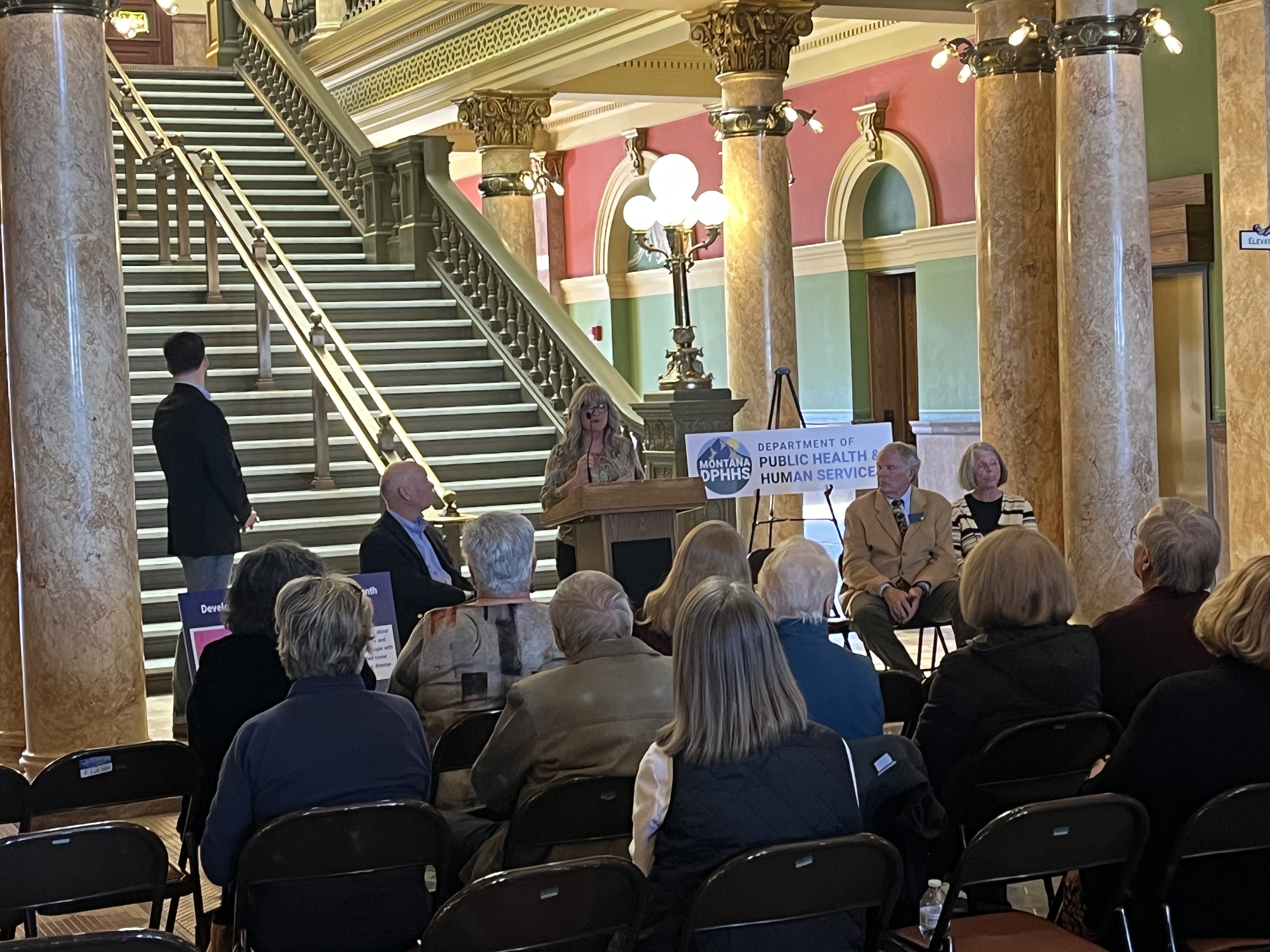 Kat McCorrmick speaking at Developmental Disabilities Awareness Month event 