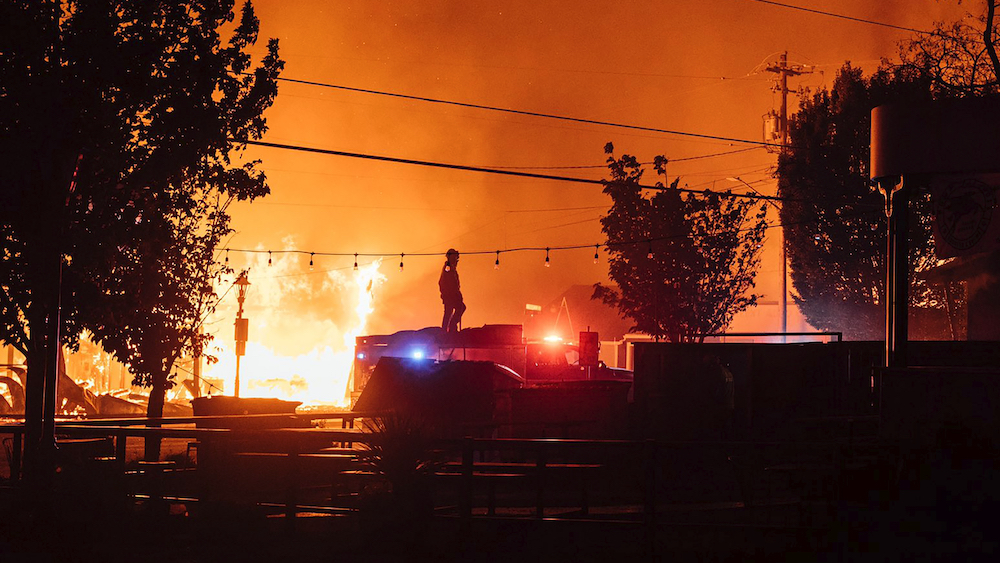 Death toll jumps sharply as wildfires continue to rage uncontrolled in western states
