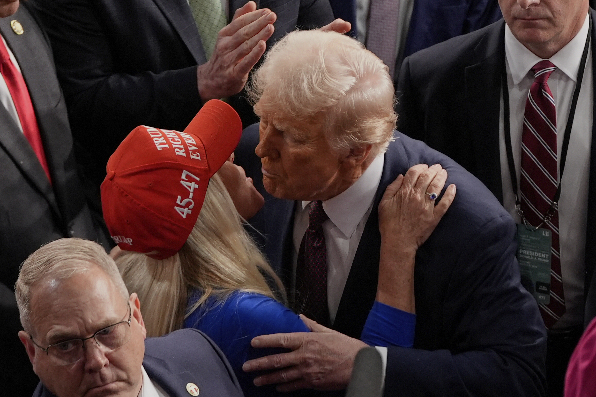 President Donald Trump greets Rep. Marjorie Taylor Greene, R-Ga., after addressing a joint session of Congress in the House chamber at the U.S. Capitol in Washington, Tuesday, March 4, 2025. 
