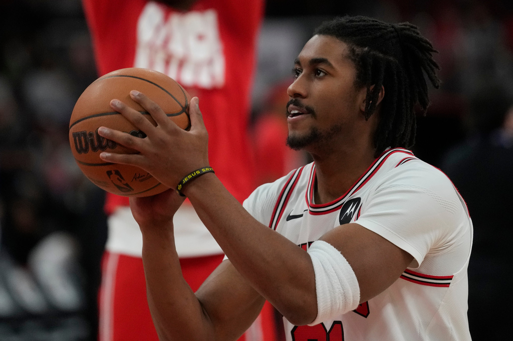 Chicago Bulls guard Jaden Ivey warms up before an NBA basketball game.