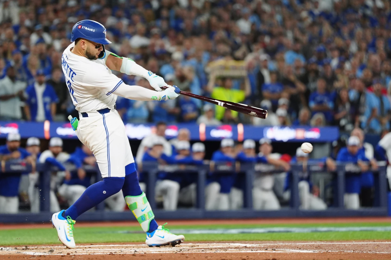 Toronto Blue Jays' Bo Bichette hits a single against the Los Angeles Dodgers during the first inning of Game 1 of baseball's World Series, Friday, Oct. 24, 2025, in Toronto.