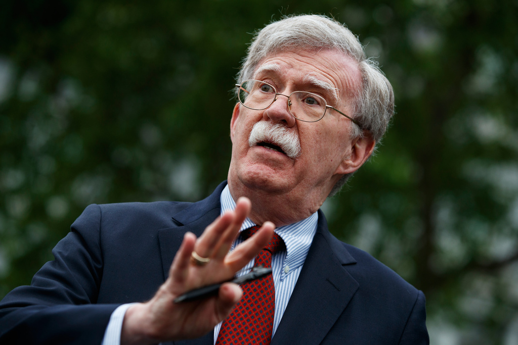 National security adviser John Bolton talks to reporters about Venezuela, outside the White House, May 1, 2019, in Washington.