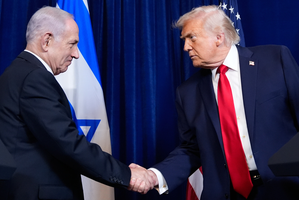 President Donald Trump shakes hands with Israel's Prime Minister Benjamin Netanyahu.