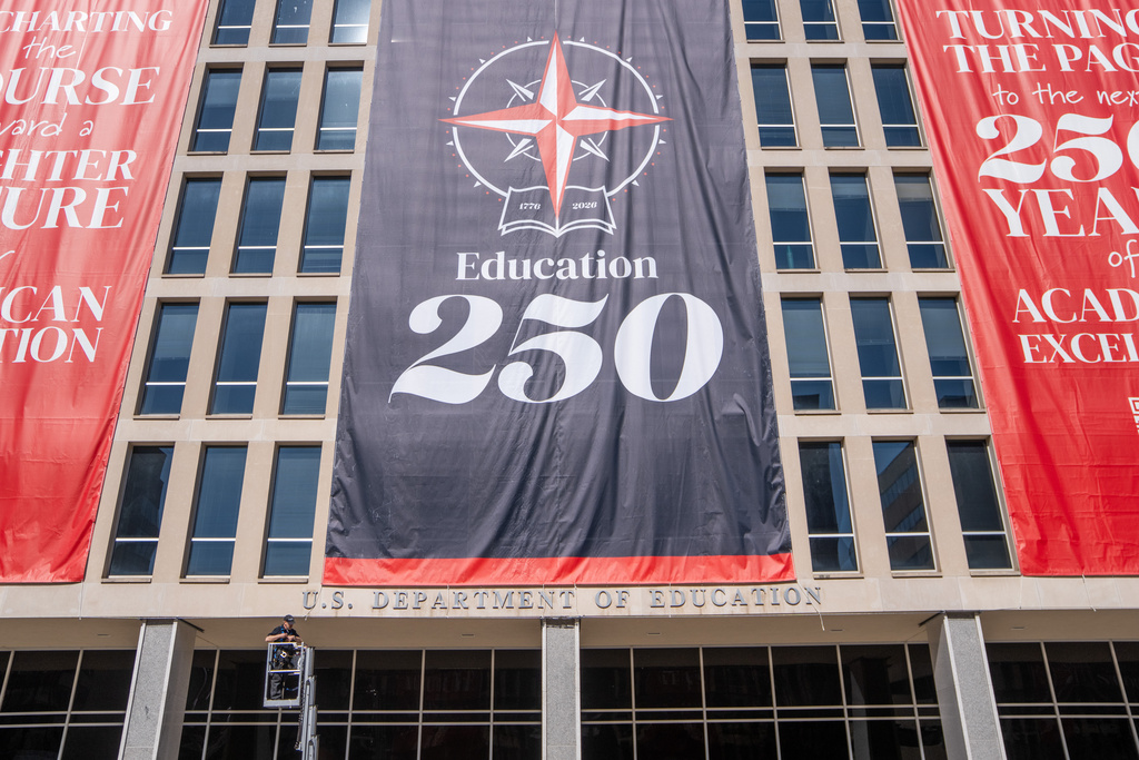 Banners hang from the Department of Education, Sunday, March 1, 2026, in Washington.