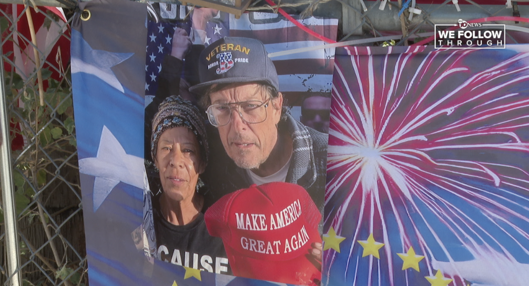 Maria Garcia and Kerry Sheron in a picture on the fence outside Escondido's "Trump House." 