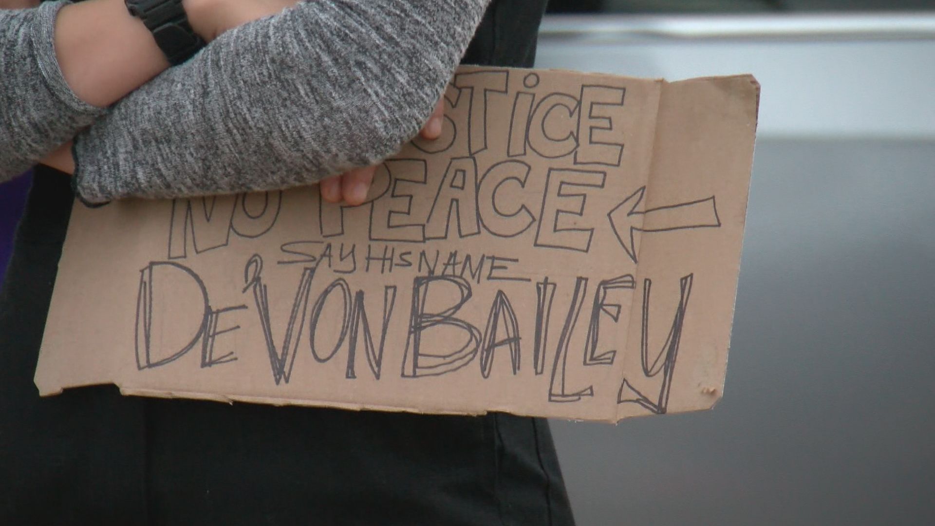 Demonstrators march in CSPD Sergeant's neighborhood on the anniversary of De'Von Bailey's death 