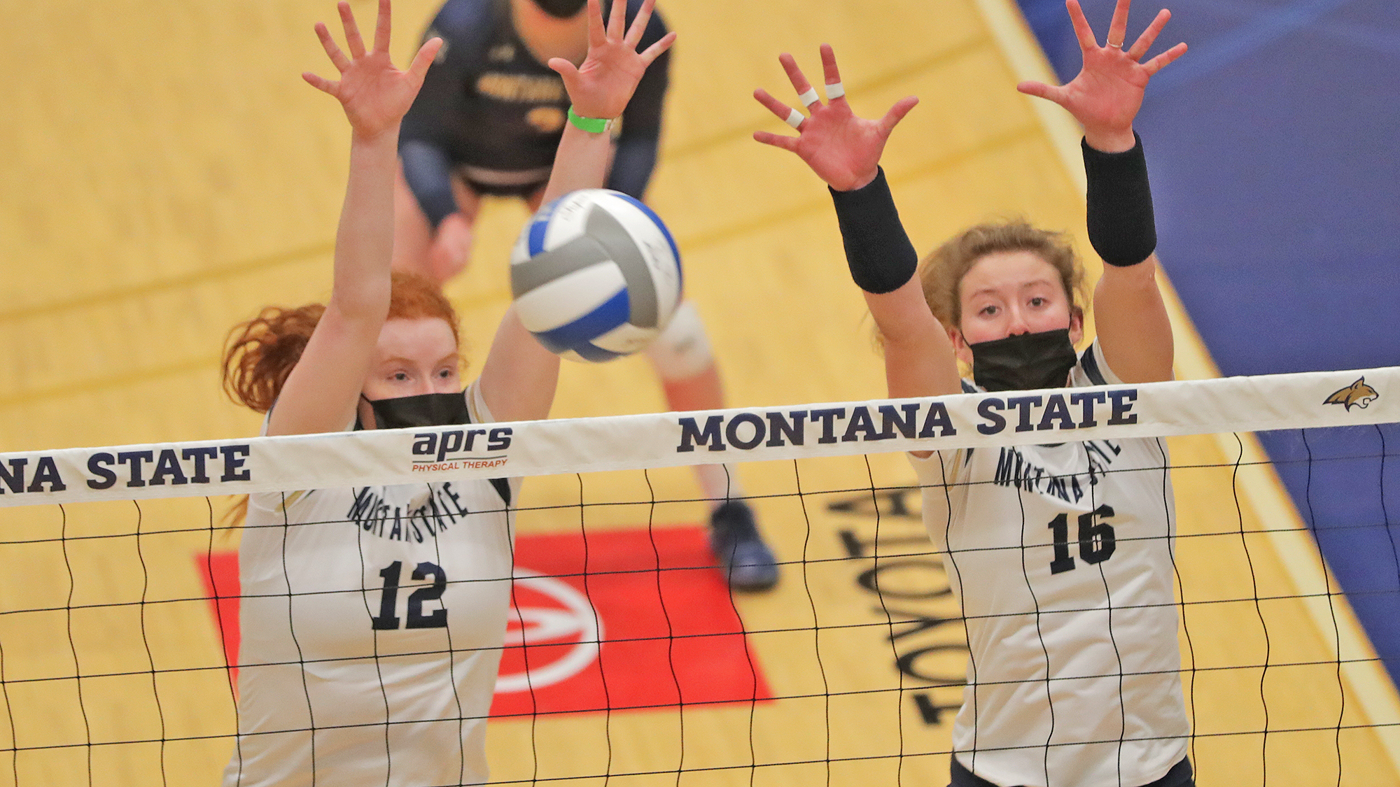 Emma Pence (12) and Hannah Scott (16) blocking