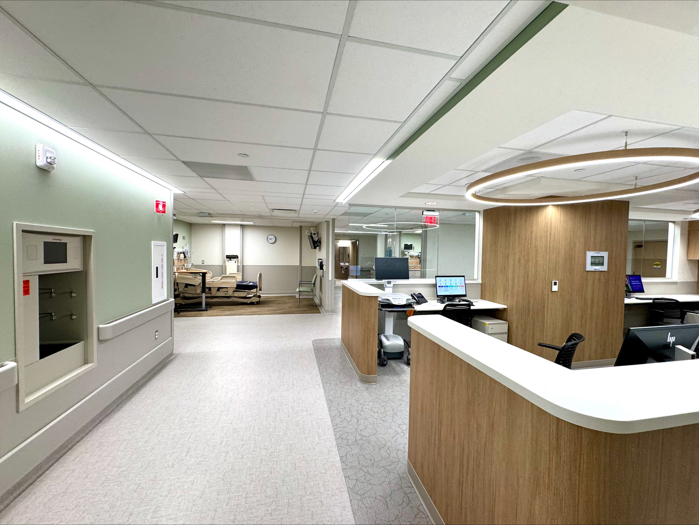 new nurses station with patient room visible.jpeg