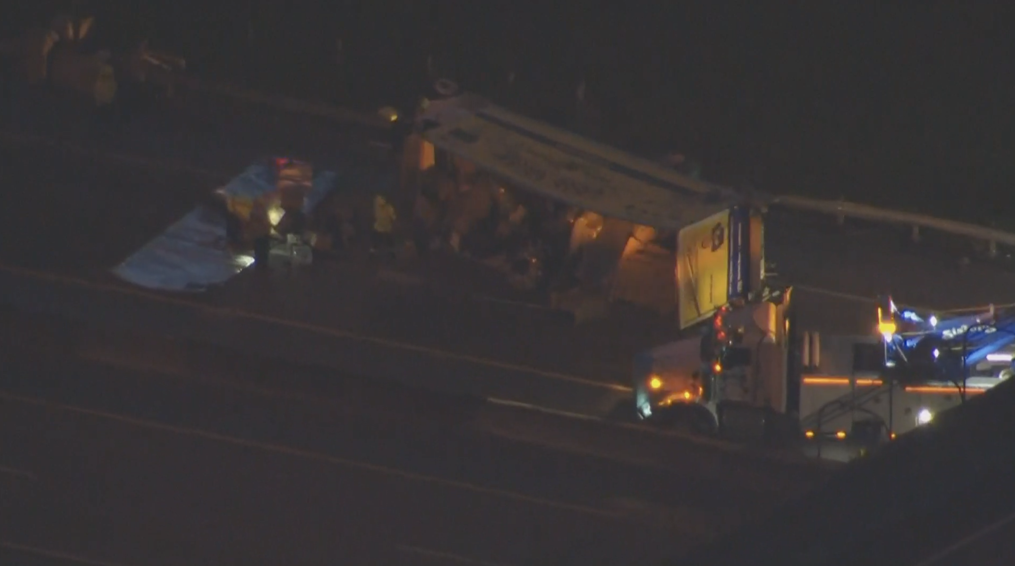 overturned tractor-trailer in northbound lanes of Florida's Turnpike in Palm Beach Gardens