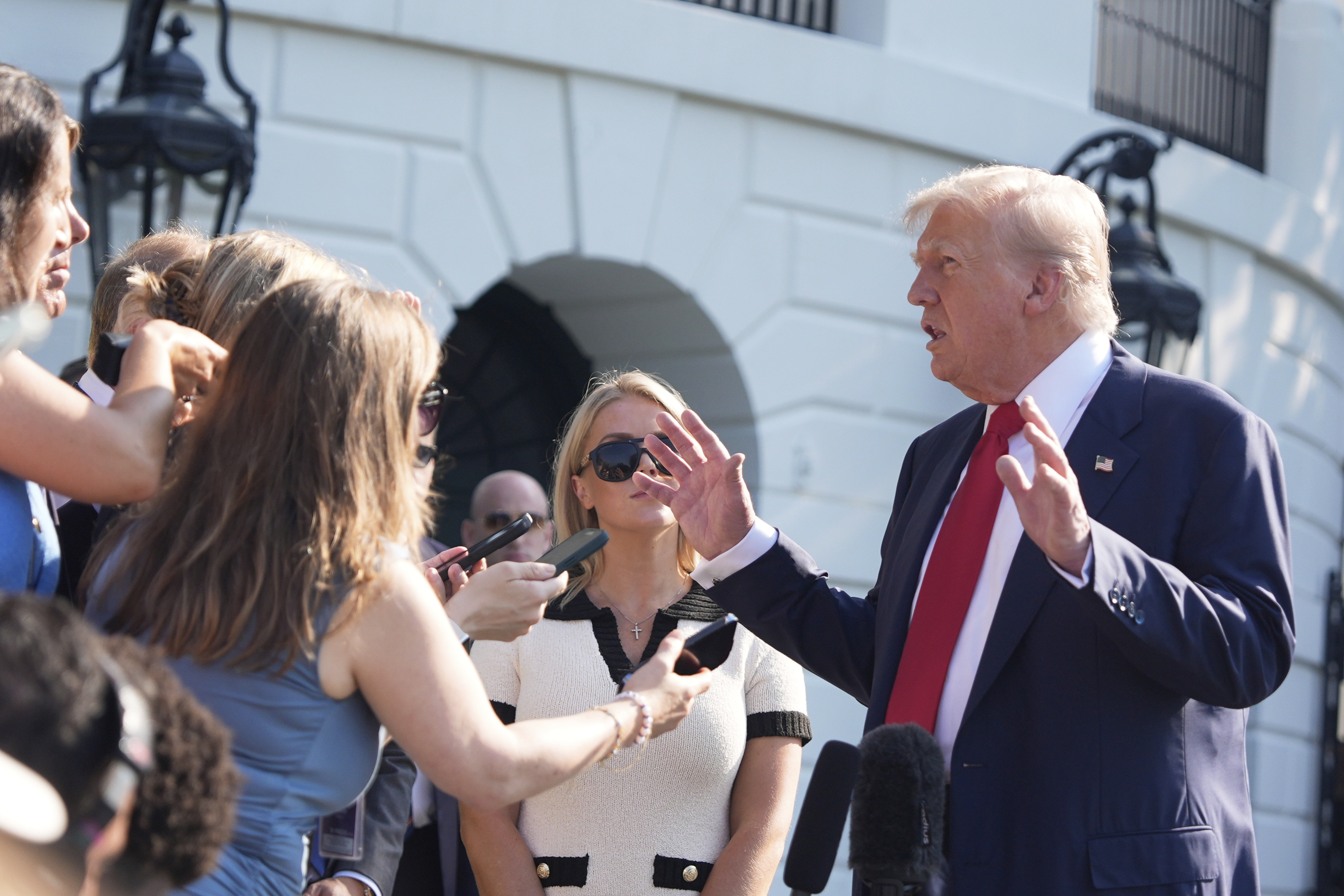 President Donald Trump speaks with reporters before departing on Marine One from the South Lawn of the White House, Friday, July 25, 2025, in Washington. The President is traveling to Scotland.