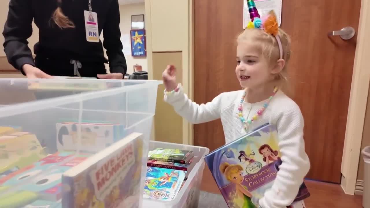 Kid picks out free book 