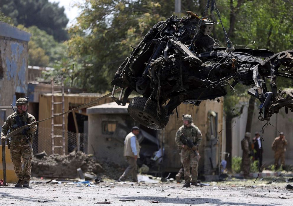 Resolute Support (RS) forces remove a damaged vehicle after a car bomb explosion in Kabul, Afghanistan, Sept. 5, 2019. A car bomb exploded near a neighborhood housing the U.S. Embassy in Kabul (Rahmat Gul/AP).