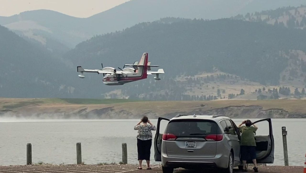 "Scooper" plane skims Holter Lake