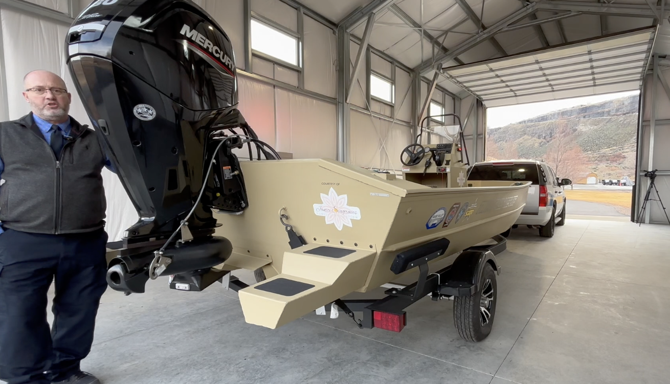 Sgt Ken Mencl shows off the new boat and boathouse on Wednesday, Dec 18, 2024 at Centennial Park