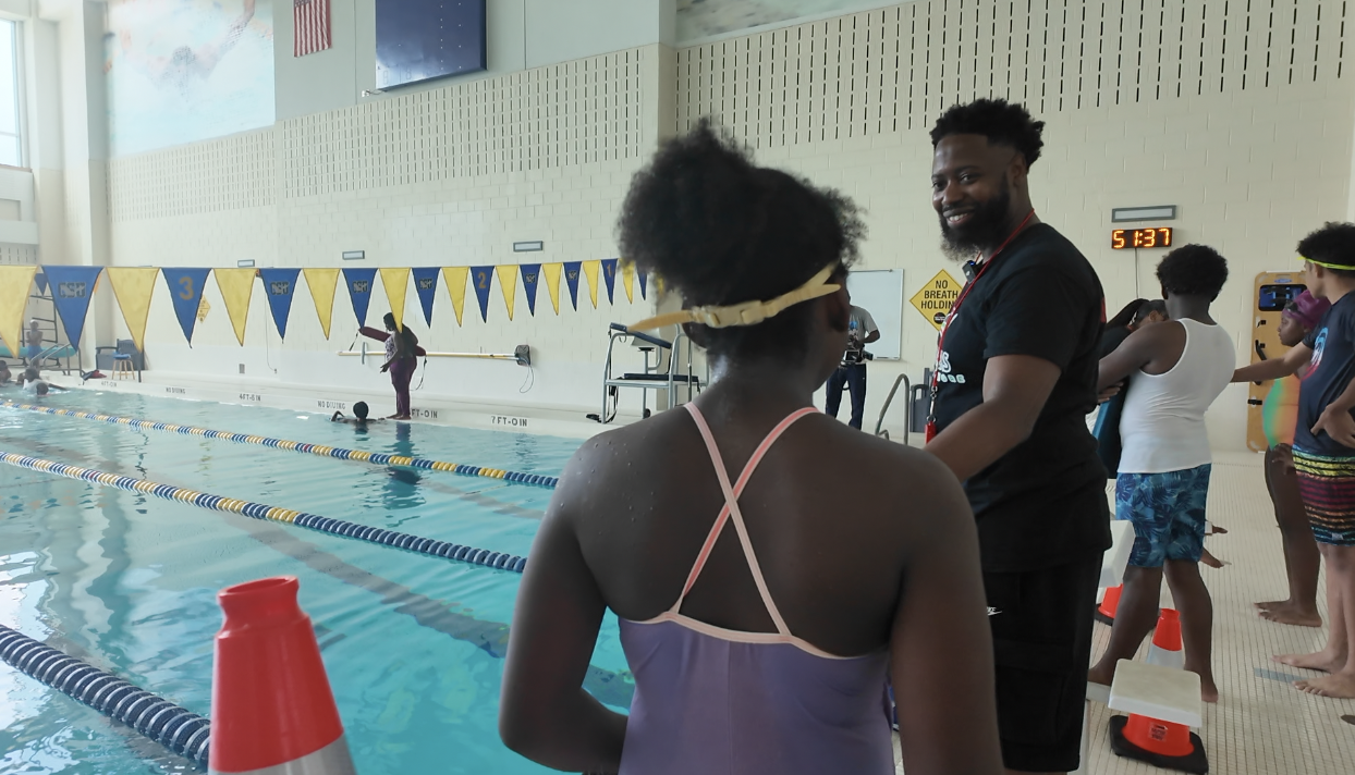 Coach Danny with the swimmers