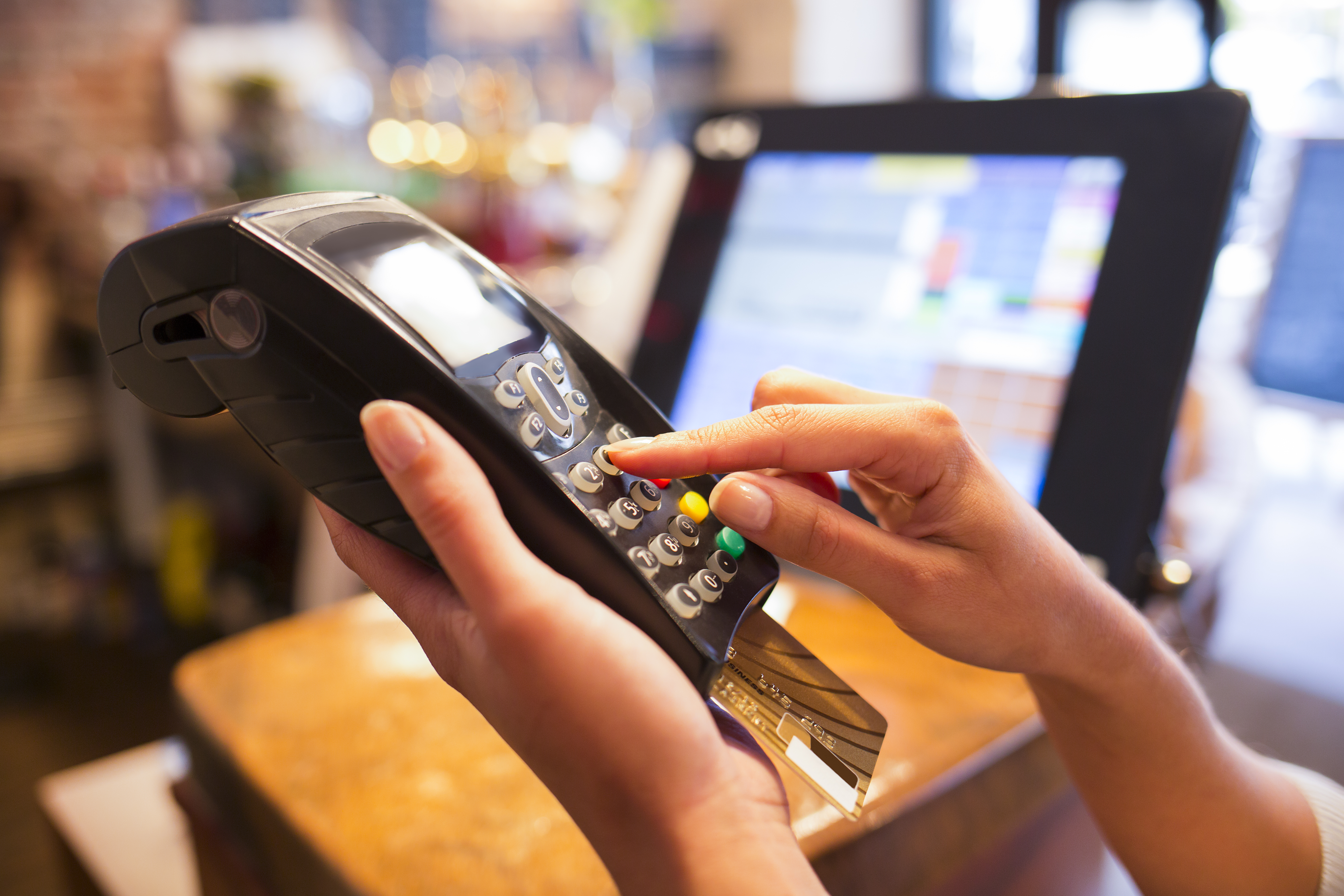 Woman,Hand,With,Credit,Card,Swipe,Through,Terminal,For,Sale