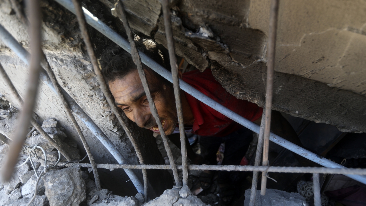 Palestinians look for survivors under the rubble.
