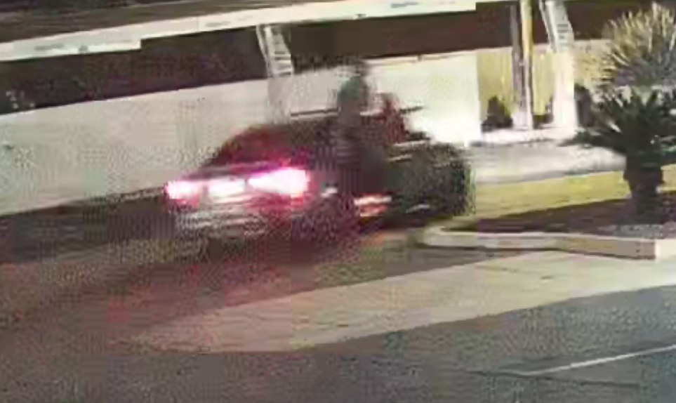 Police are looking for this car and the passenger hanging outside one of the doors in connection to last month's deadly house party shooting near the University of Arizona.