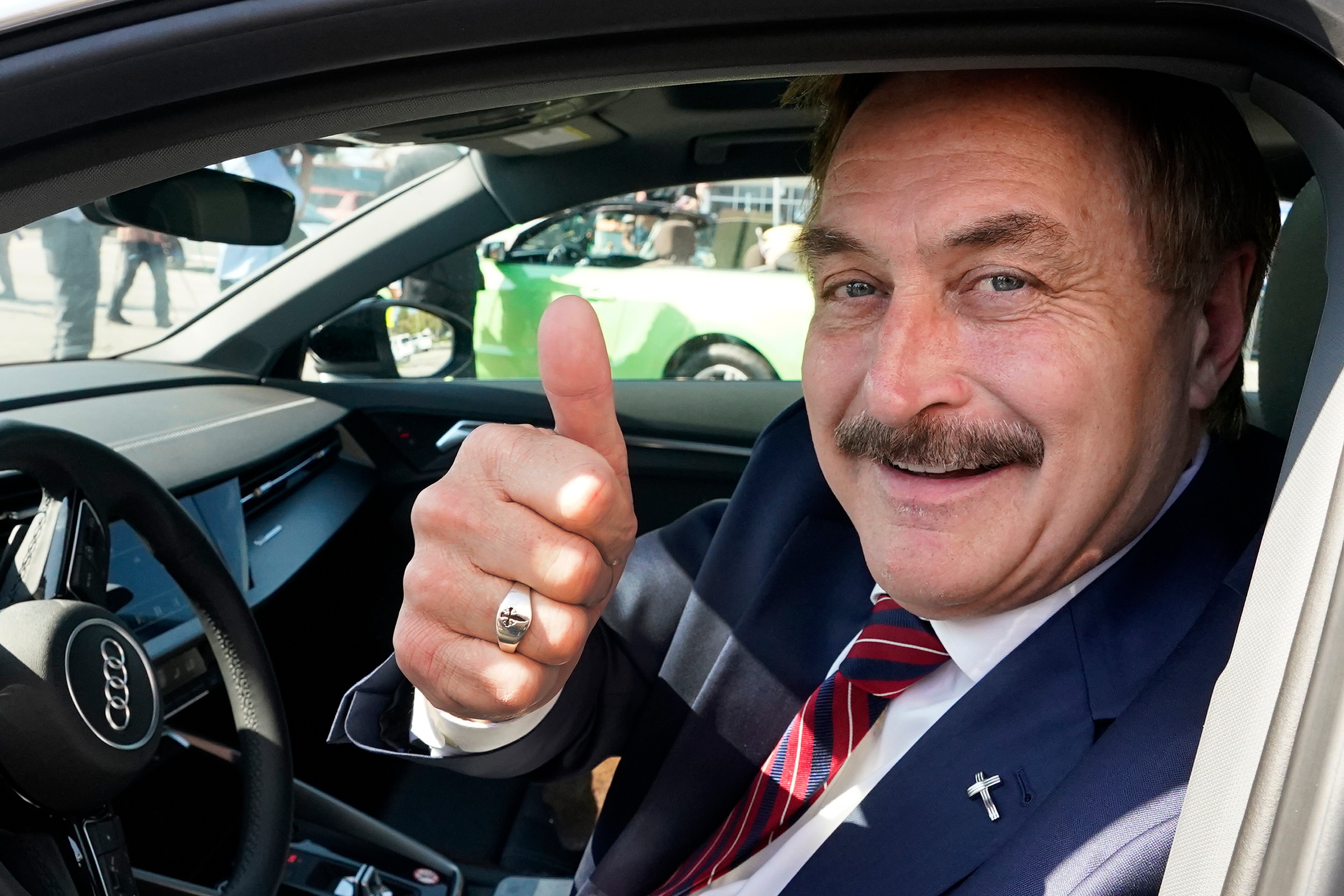 FILE - Mike Lindell gives a thumbs up as he passes by a rally for supporters of former President Donald Trump, April 4, 2023, in West Palm Beach, Fla.