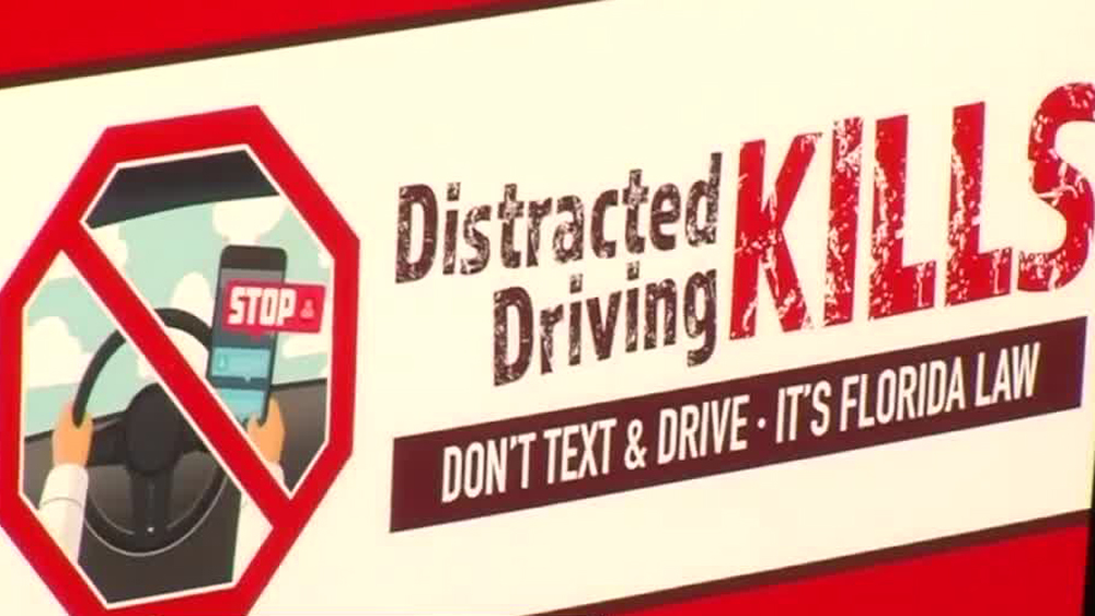 wptv-texting-while-driving-kills-sign.jpg