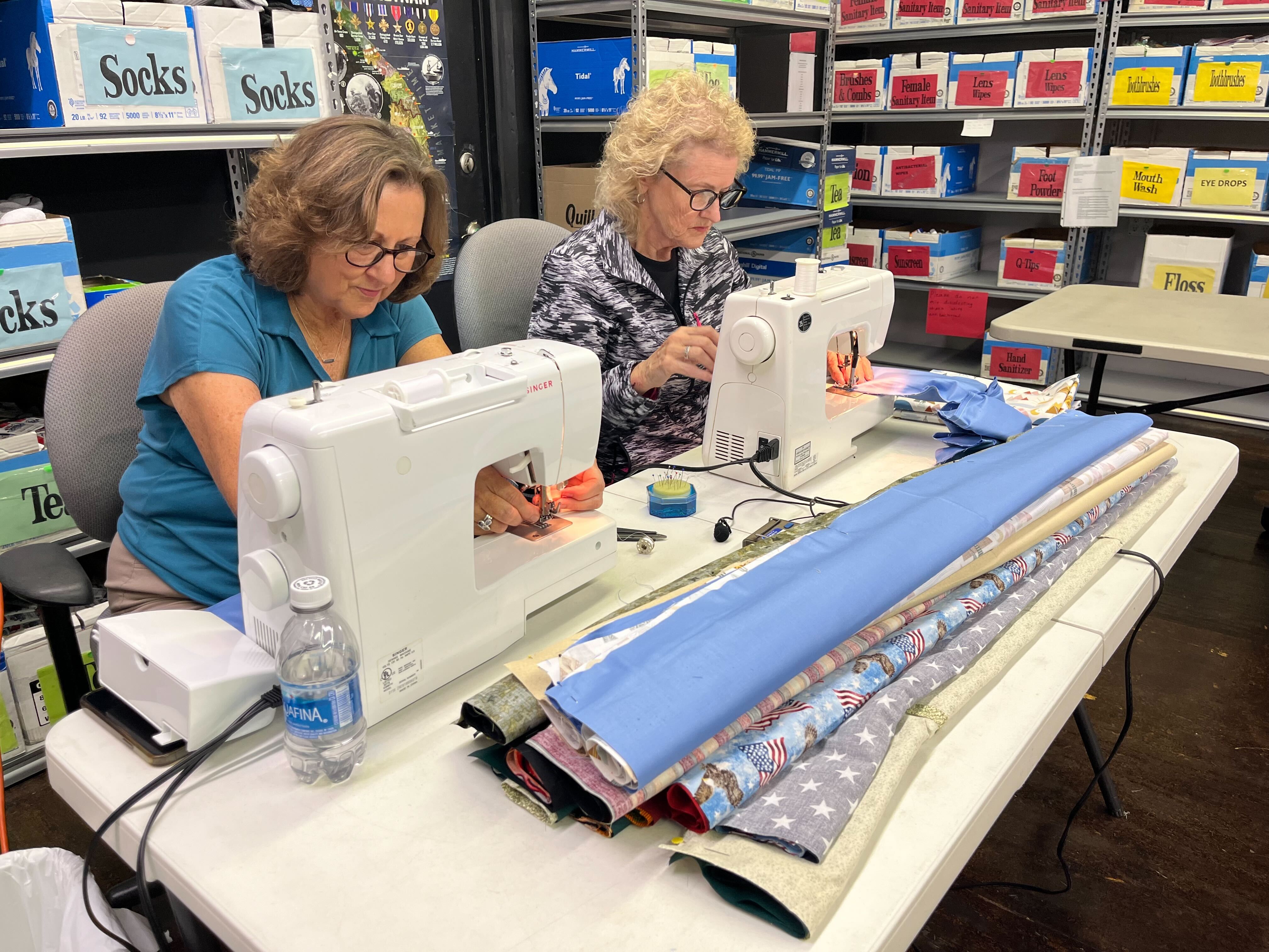volunteers sewing pillowcases