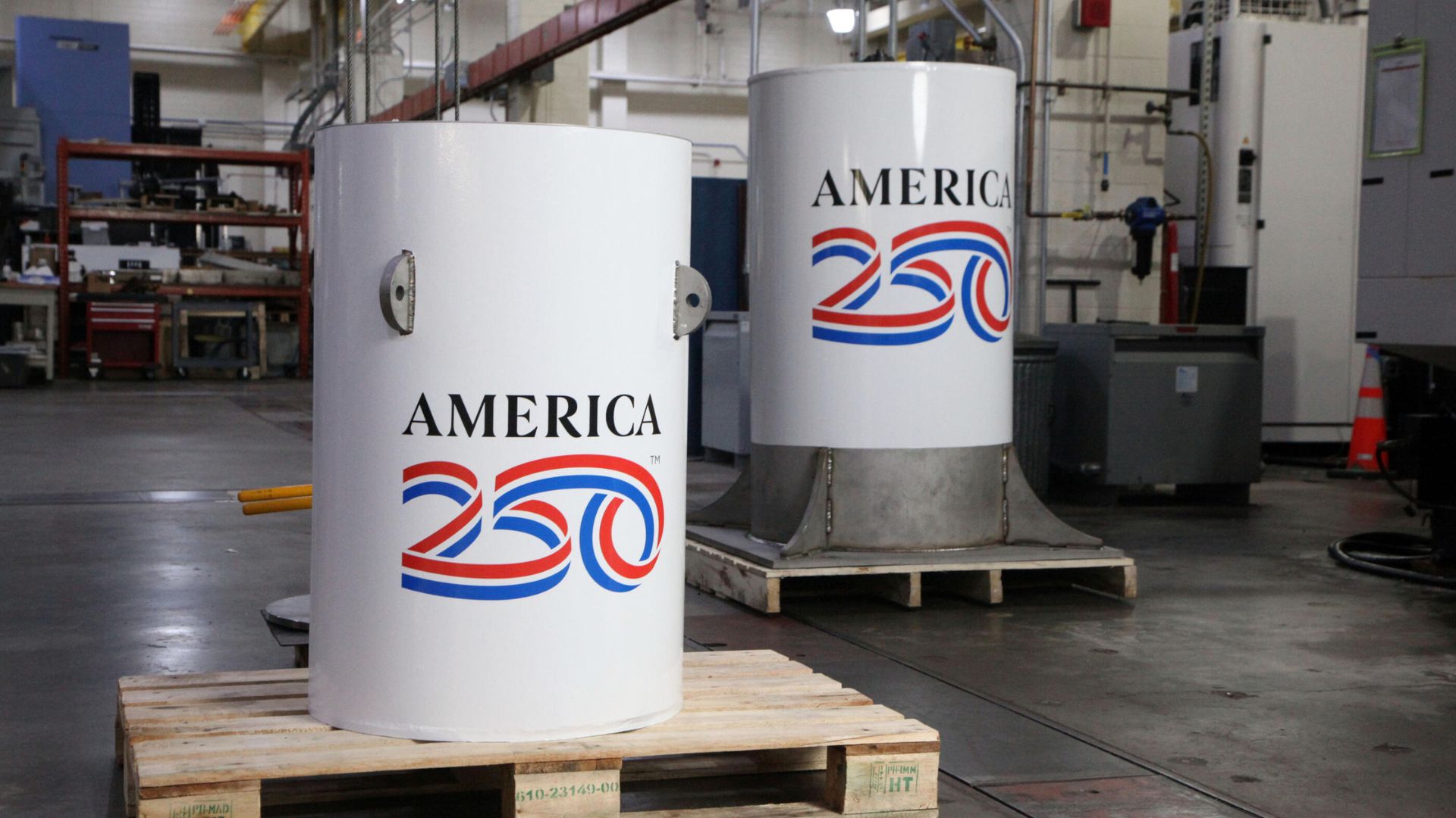 The America250 time capsule, left, and the bell jar that will fit on top of it, shown here in the machine shop where they were created at the National Institute of Standards and Technology (NIST) in Gaithersburg, Maryland. 