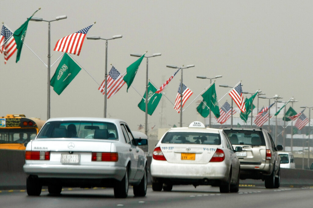 US and Saudi flags flutter on a main road in the Saudi capital Riyadh, Tuesday, June 2, 2009.