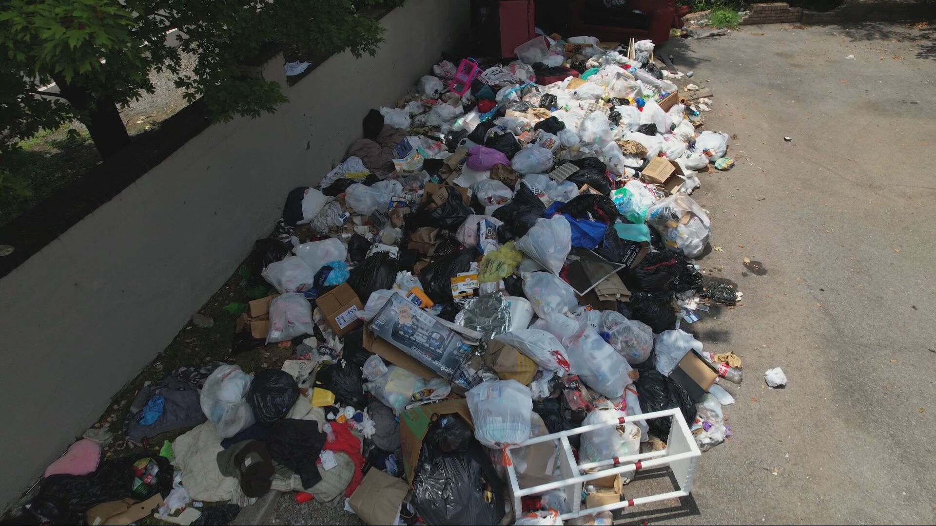 trash pile maple creek apartments 