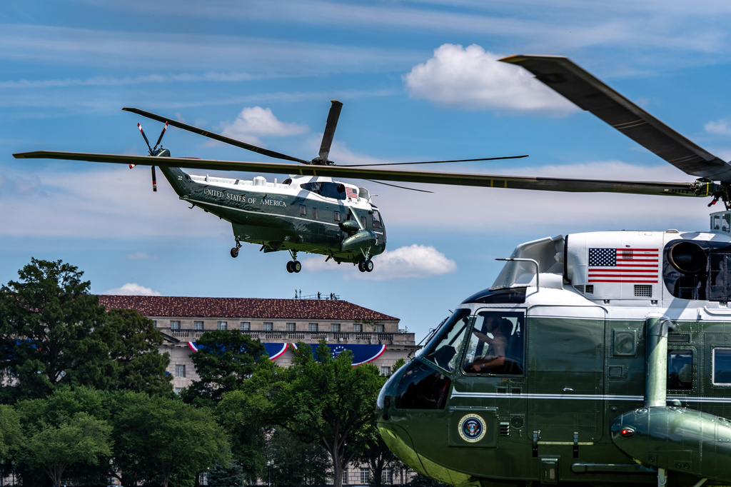 Marine One, left, with President Donald Trump aboard, lifts off from the Ellipse, Tuesday, Aug. 4, 2026, in Washington. 