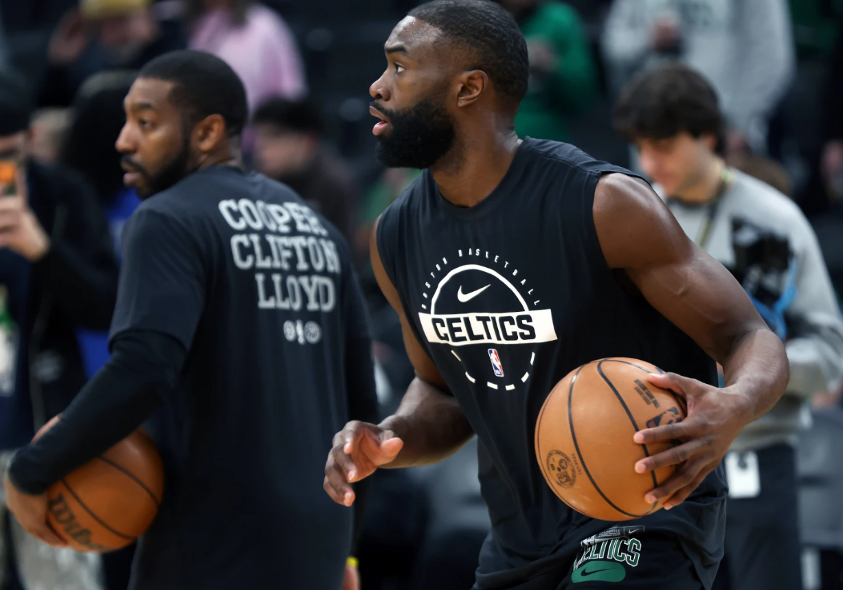 Boston Celtics' Jaylen Brown, right, warms up before an NBA basketball game against the Milwaukee Bucks, Sunday, Feb. 1, 2026, in Boston.