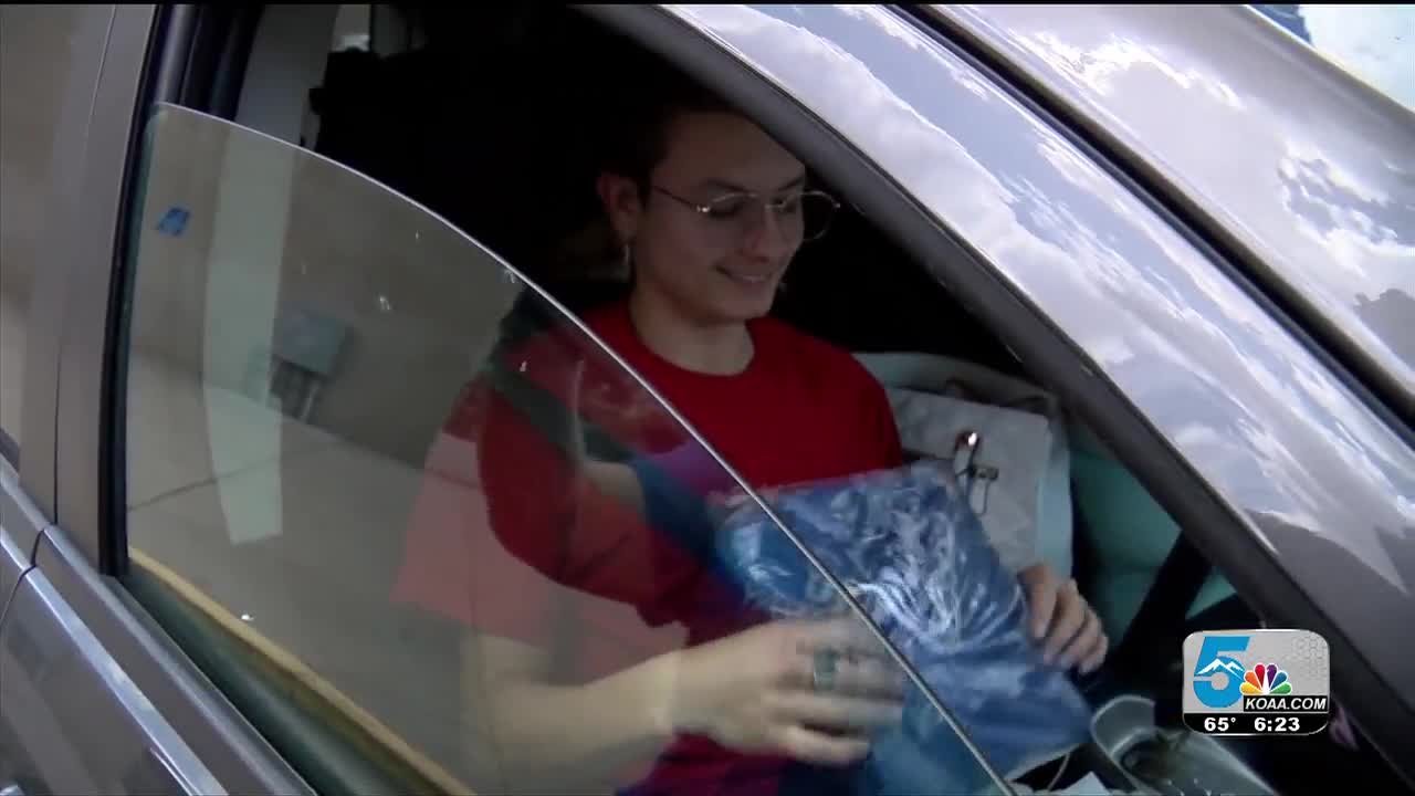 Pueblo Central Seniors receive caps and gowns at drive through
