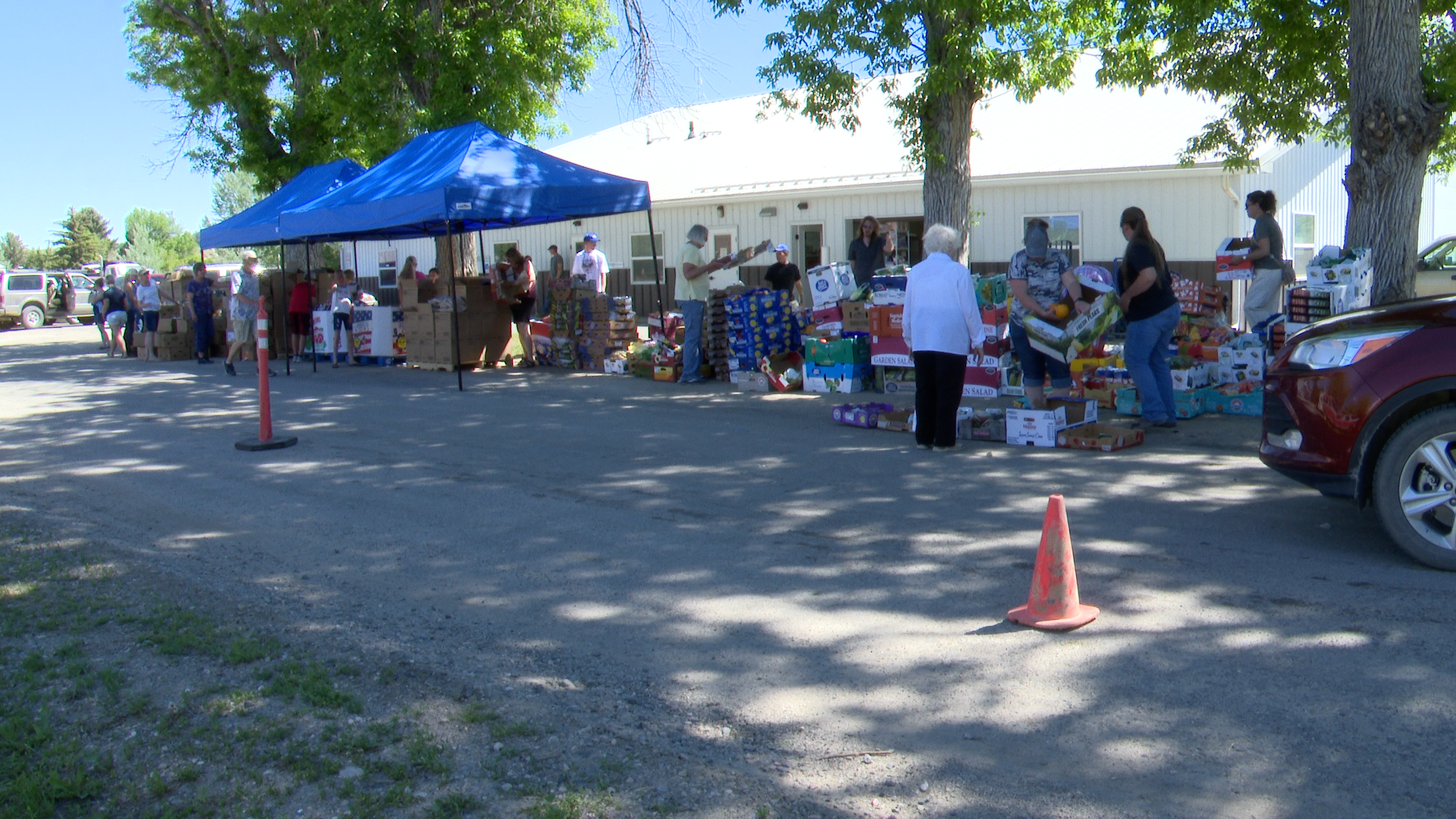 Food distribution tents and volunteers.png