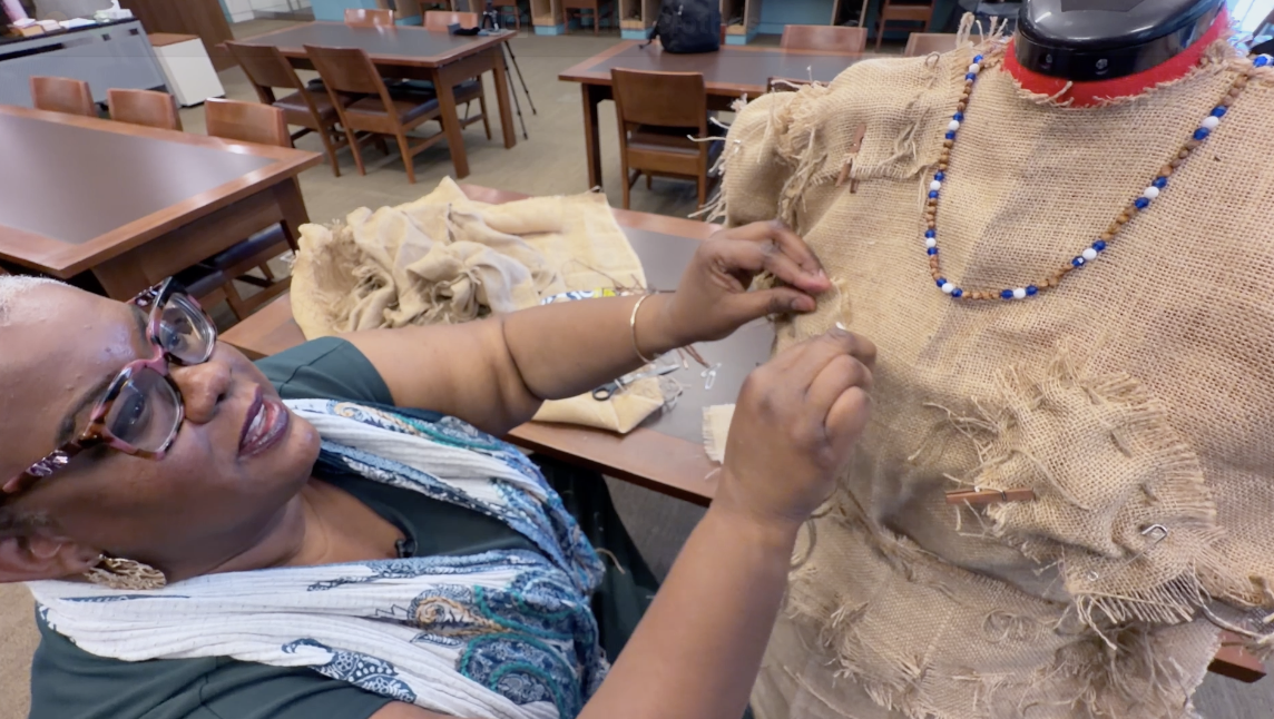 Chloe works on a dress for the Leadville show