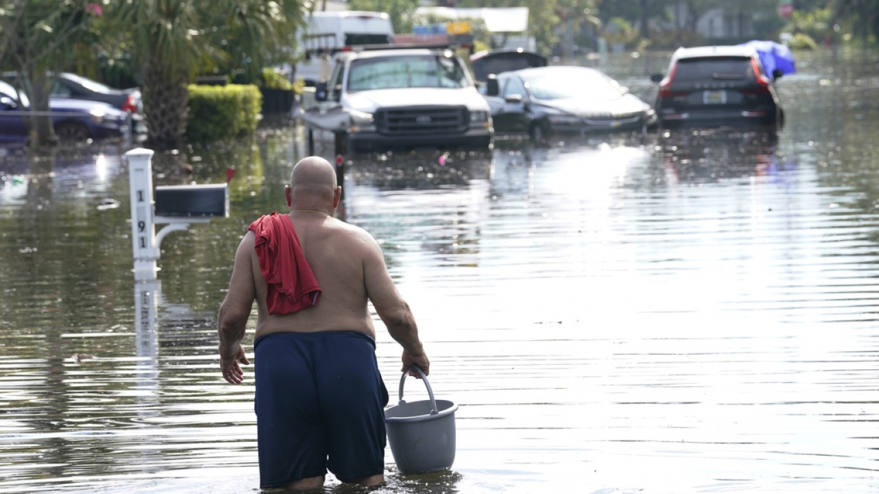 A man walks in high water.
