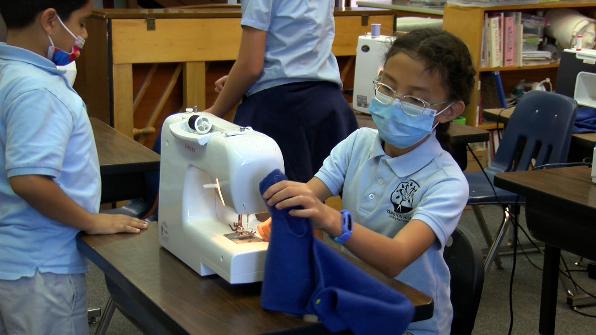 Elementary students are sewing 100 hats to gift to the homeless  