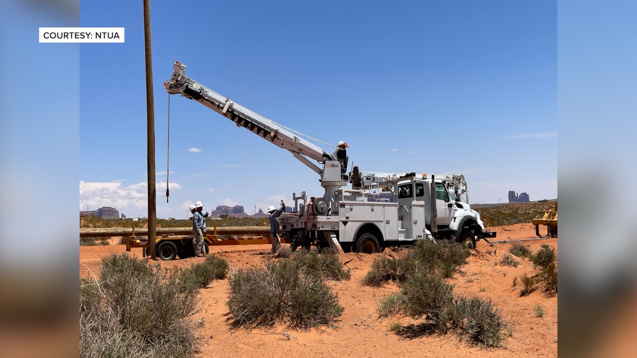 Utility workers part of the Light Up the Navajo Nation project 