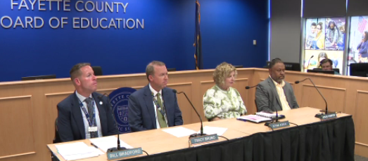A Fayette County parent of three says she's watching closely as the district faces a budget shortfall estimated between 5 and 10 million, while paying two superintendents.