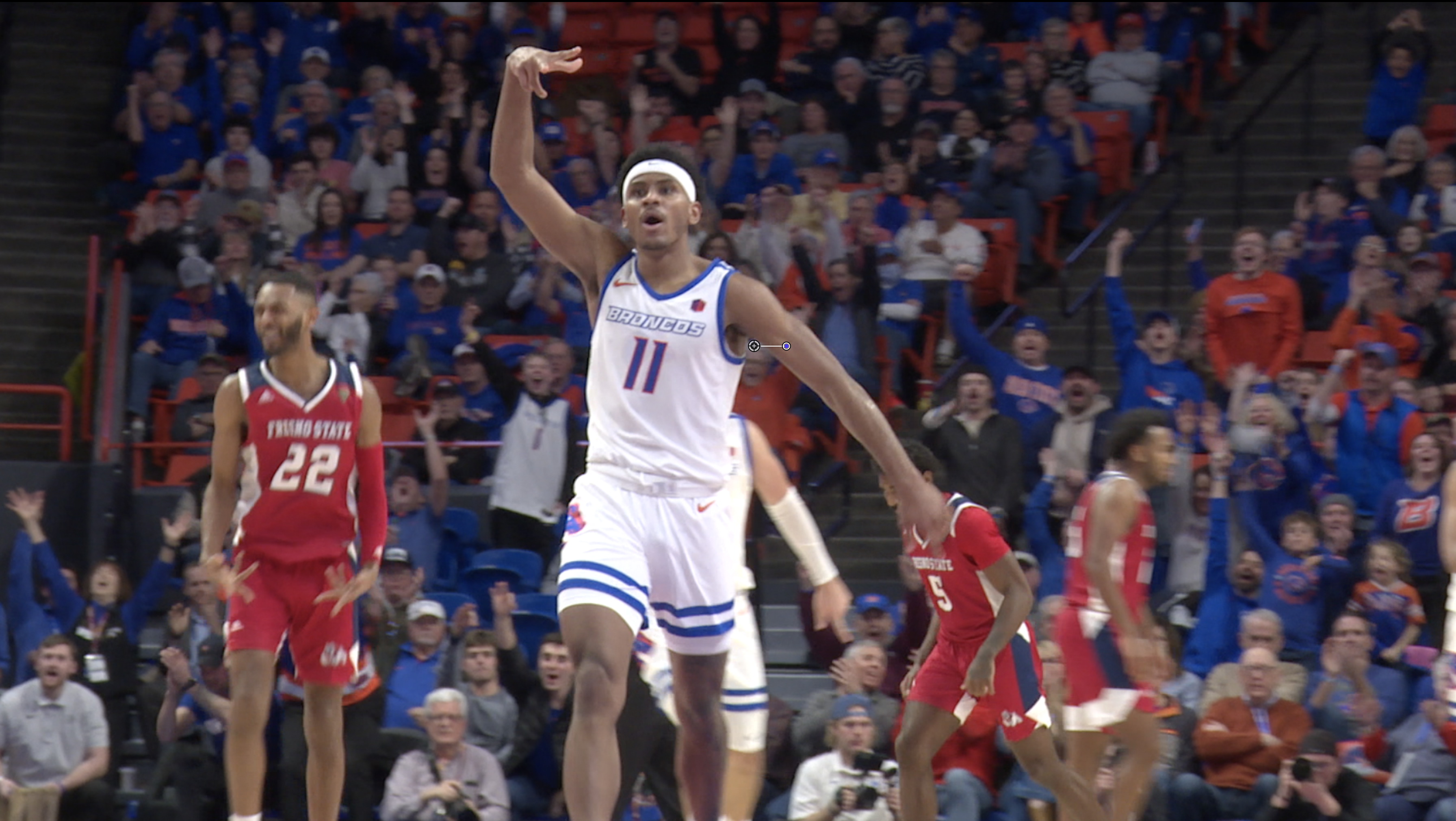 Chibuzo Agbo hits a three-point shot late in the game against Fresno State on 1/24/23