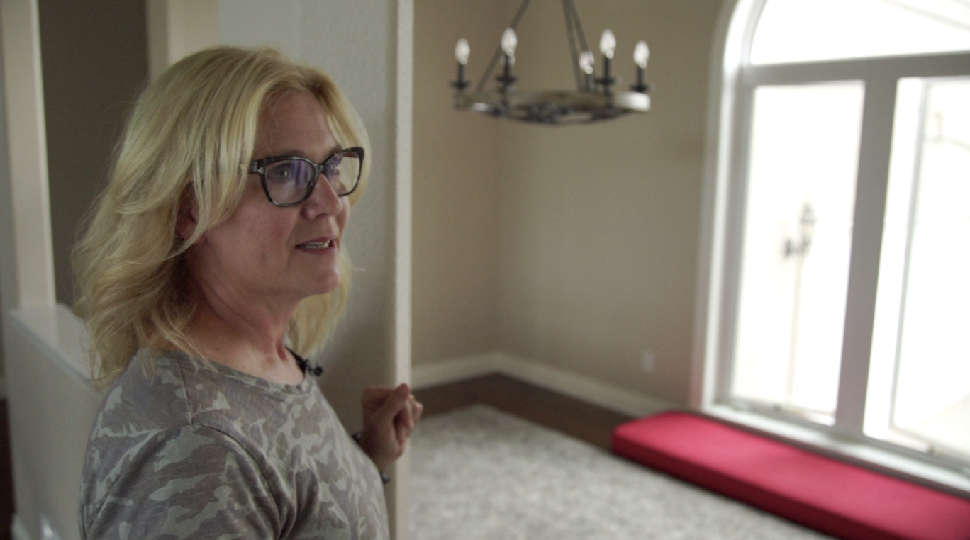 Jamie Bunting in her empty home waiting for movers to arrive
