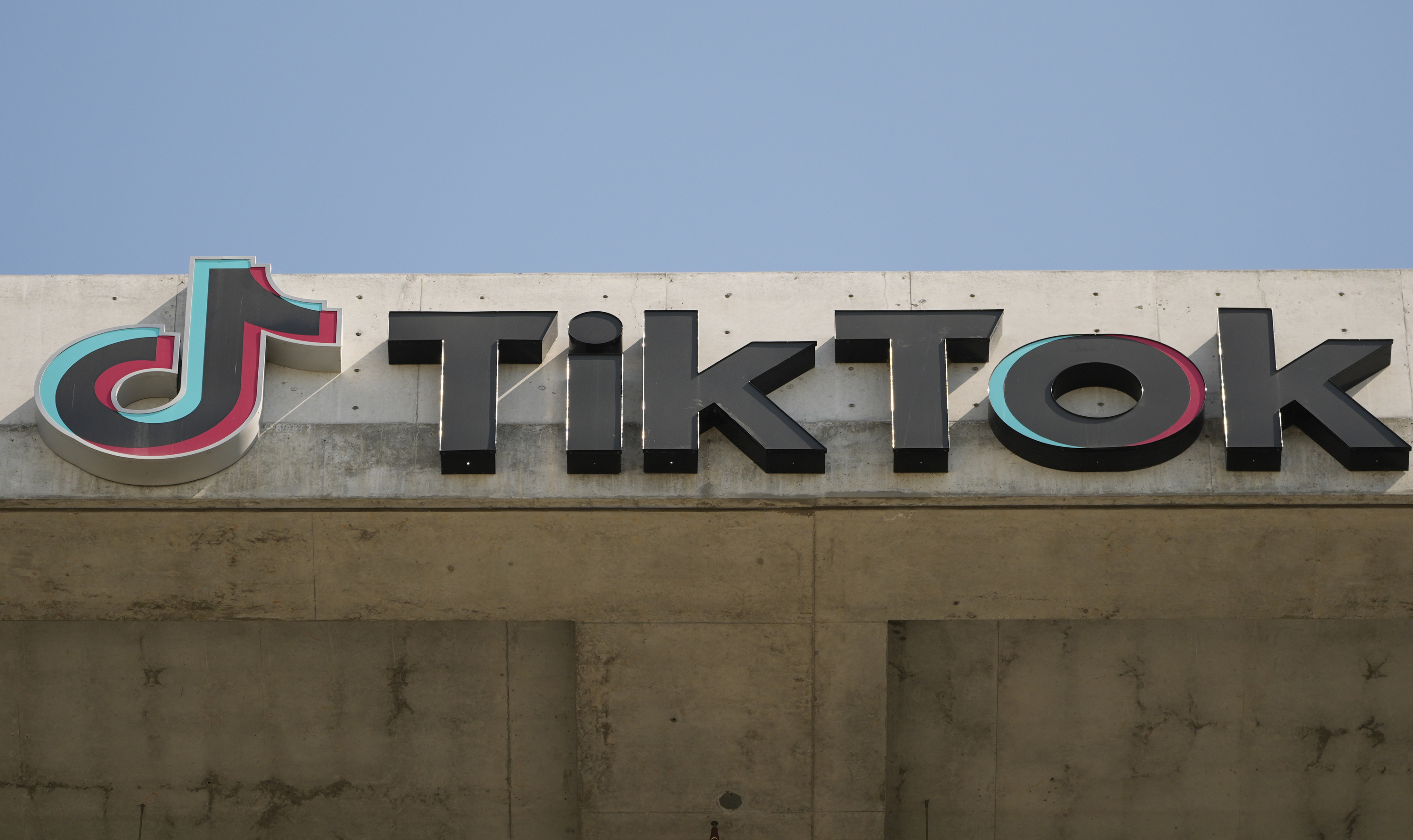 A TikTok sign is displayed on the company's building.