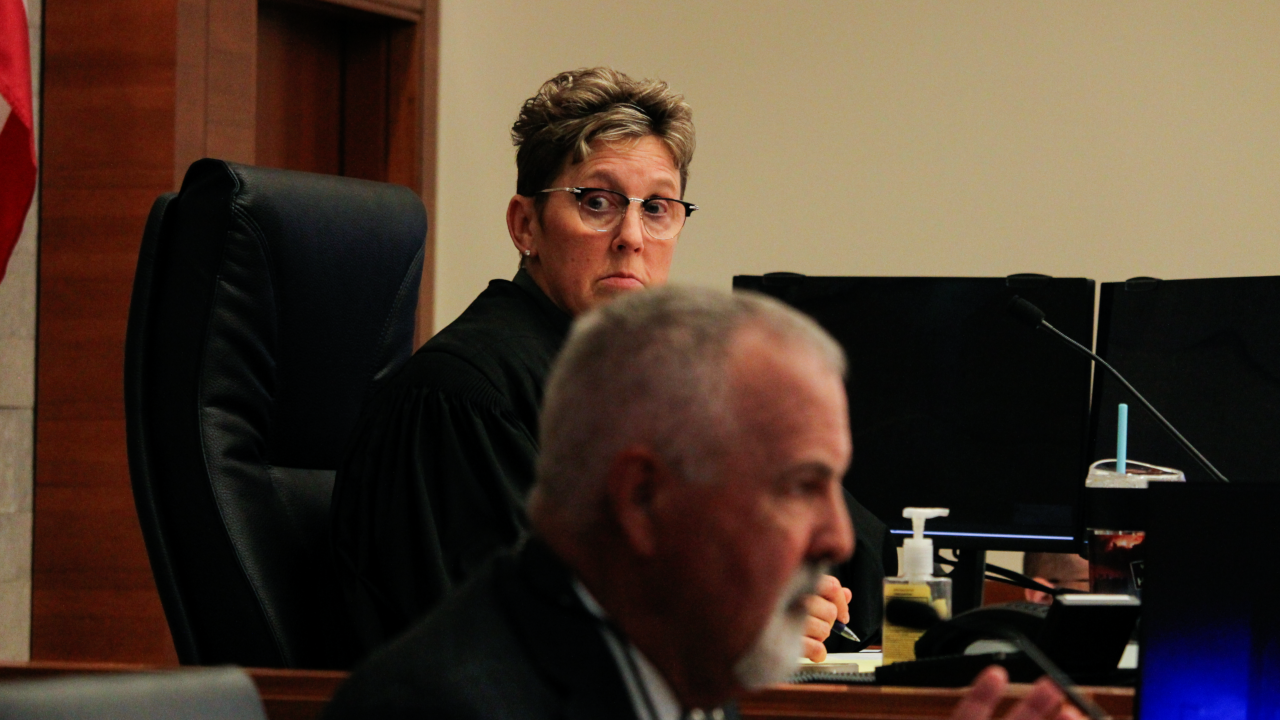 Franklin County Court of Common Pleas Judge Karen Held Phipps listening intently as lobbyist Robin Rayfield speaks