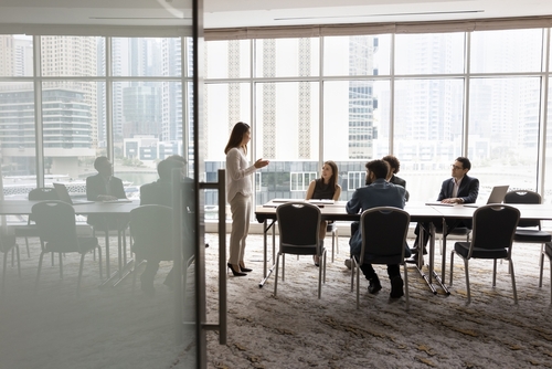 Stock image of workers in an office.