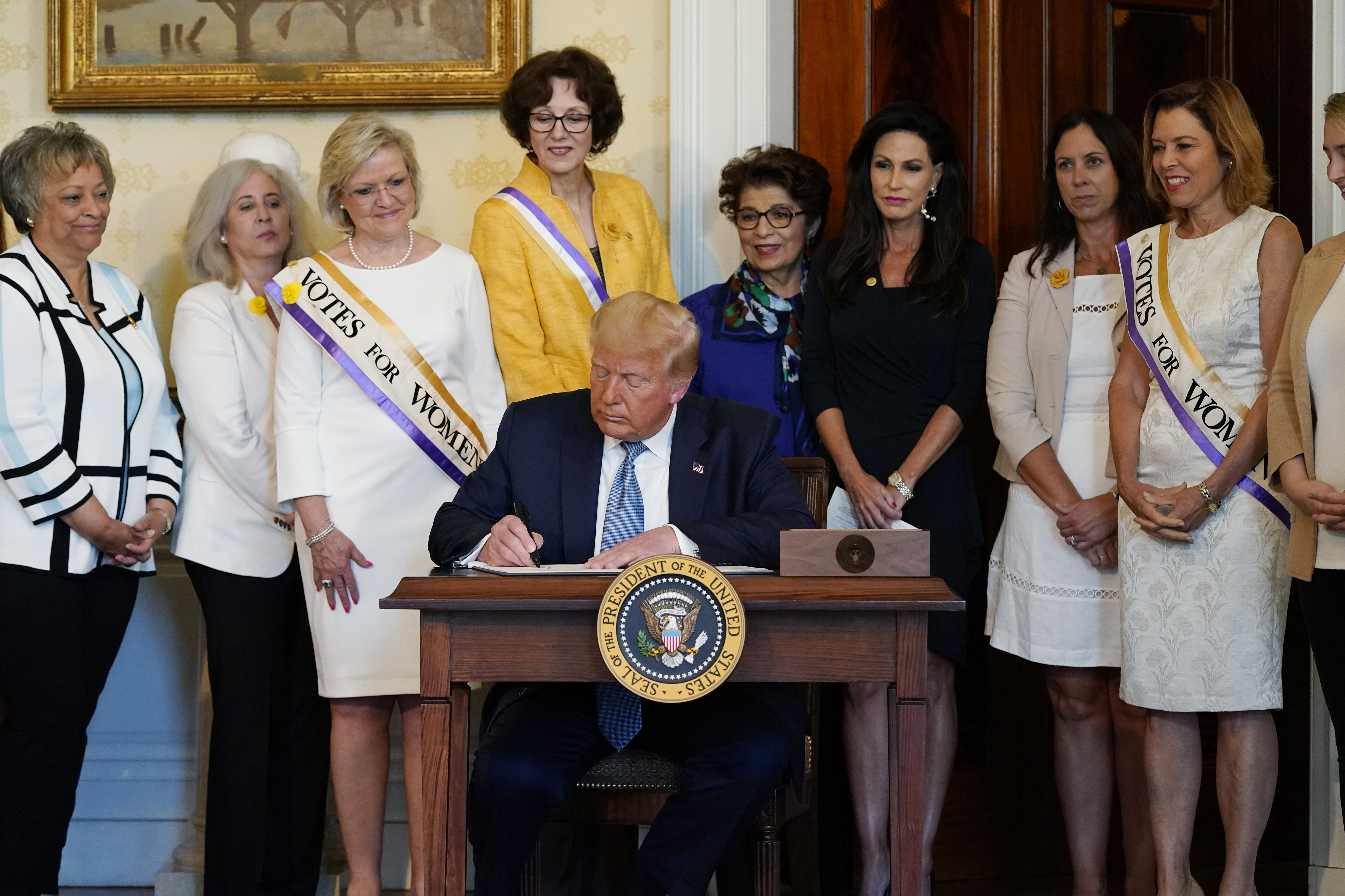 Trump angling for votes with immigration talk, nod to women