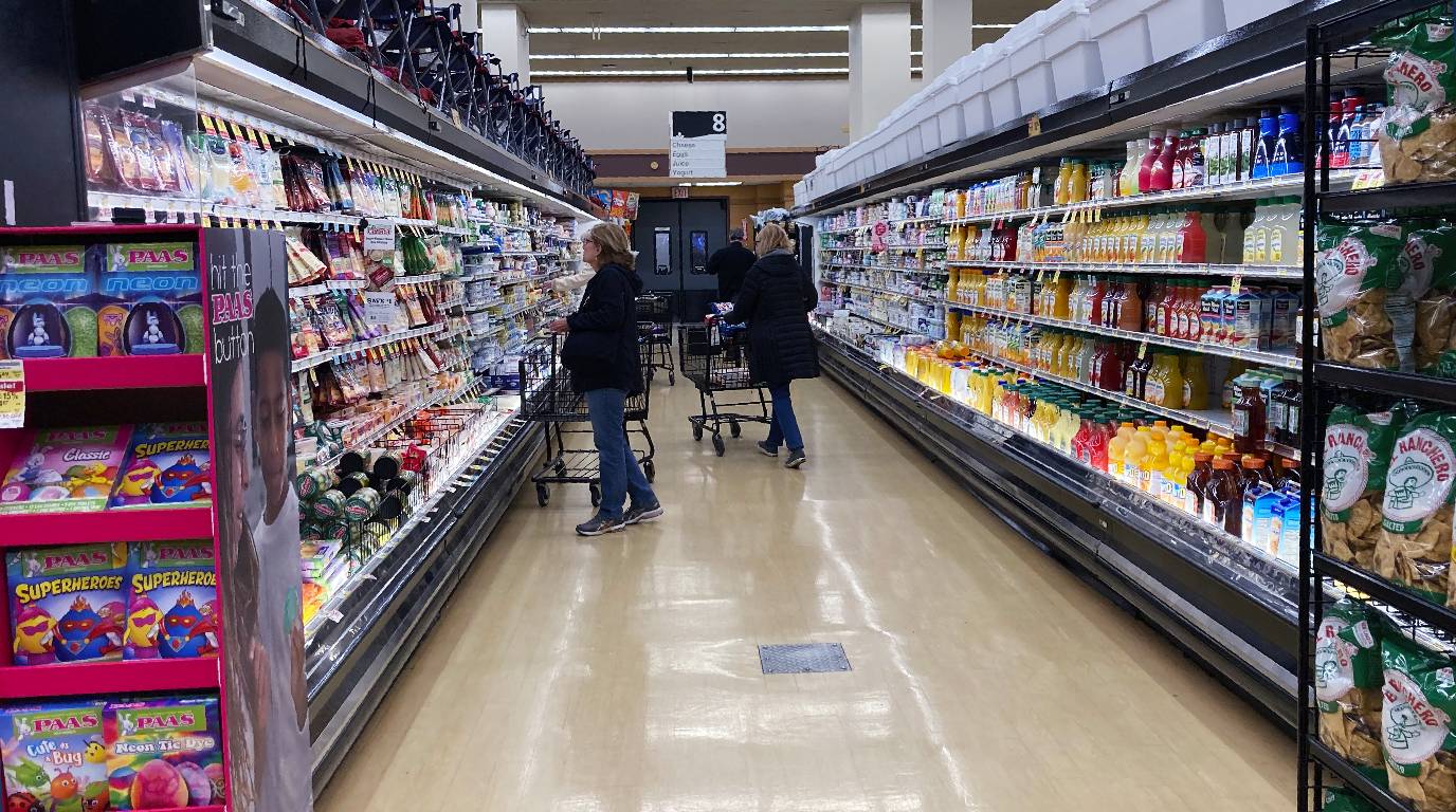 FILE: Customers shop at a grocery store. 