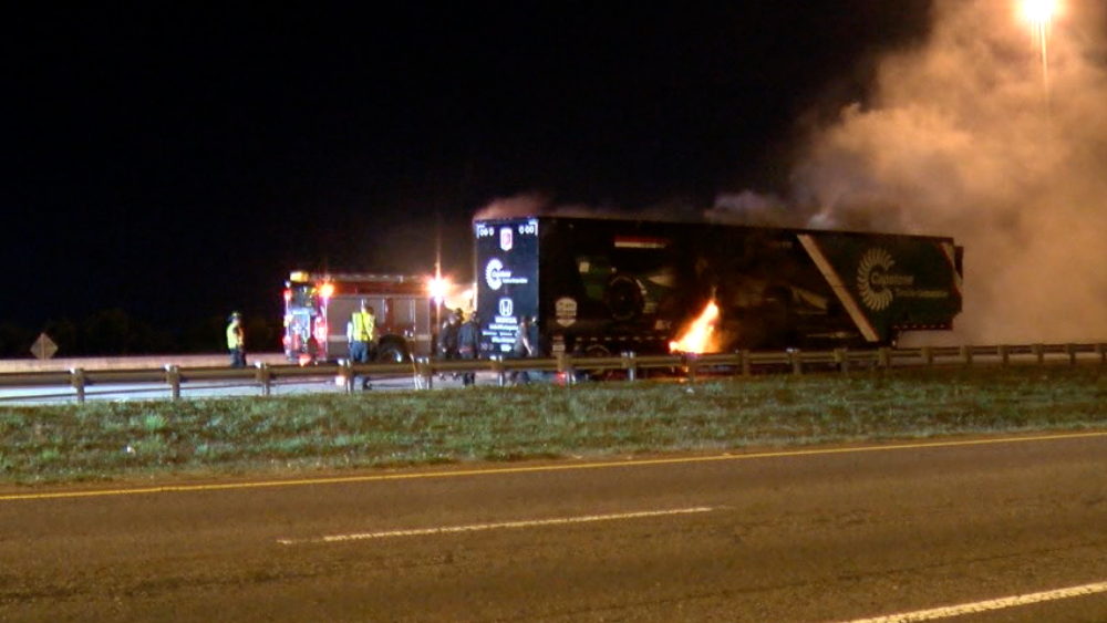 trailing hauling IndyCar on fire