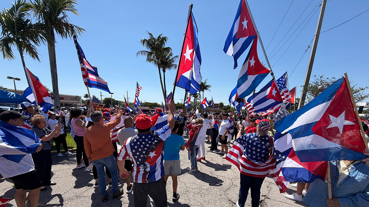 A few dozen people held a rally in support of regime change in Cuba on March 22, 2026, in West Palm Beach, right along the route President Donald Trump uses to get to Palm Beach International Airport.