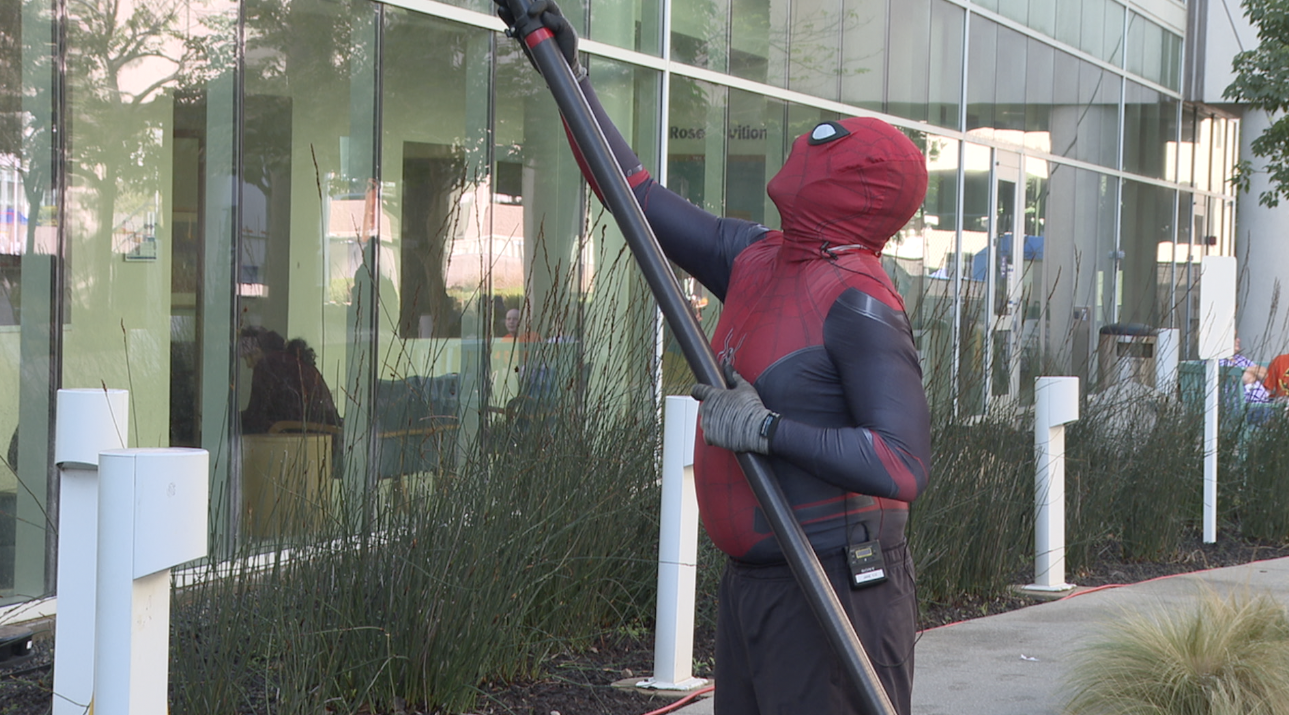 Eddie Alvarez dressed up as Spiderman, cleaning the windows of Rady Children's Hospital. 