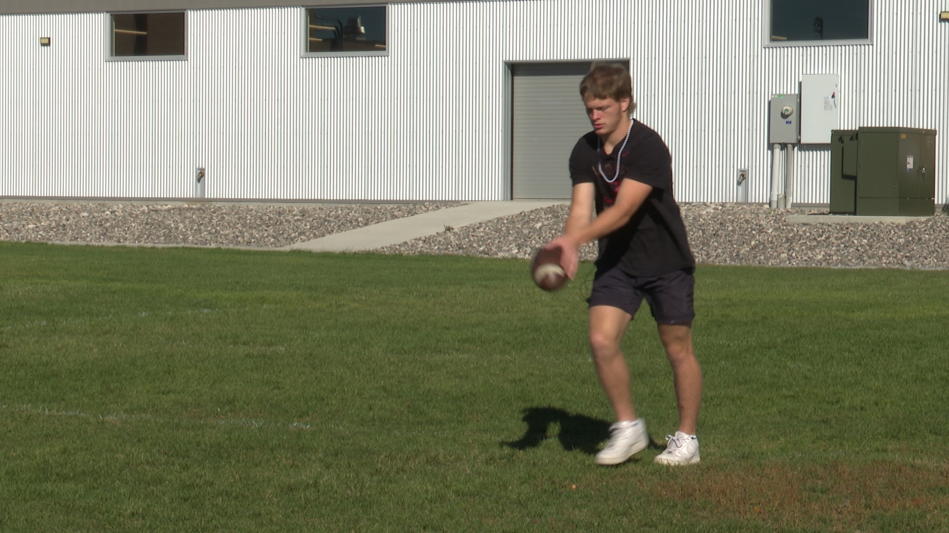 Owen punting a football
