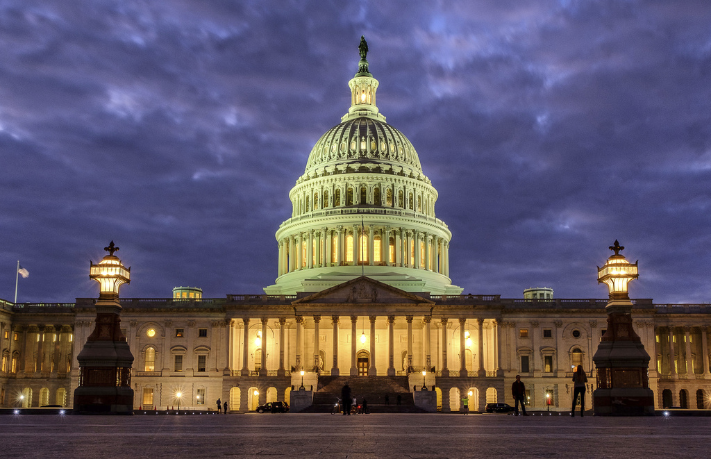 Lights shine inside the U.S. Capitol Building.